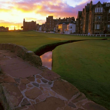 Image of iconic bridge at St Andrews Old Course at sunset