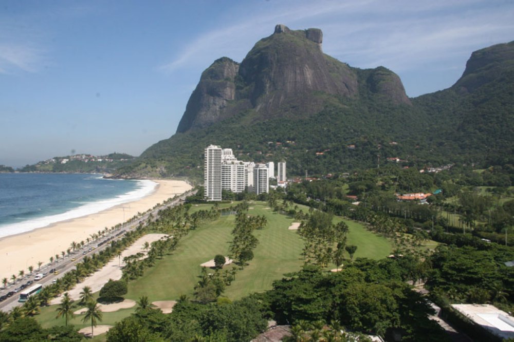 Holes from the Gavea Golf course by the beach, with the Gavea Rock in the background
