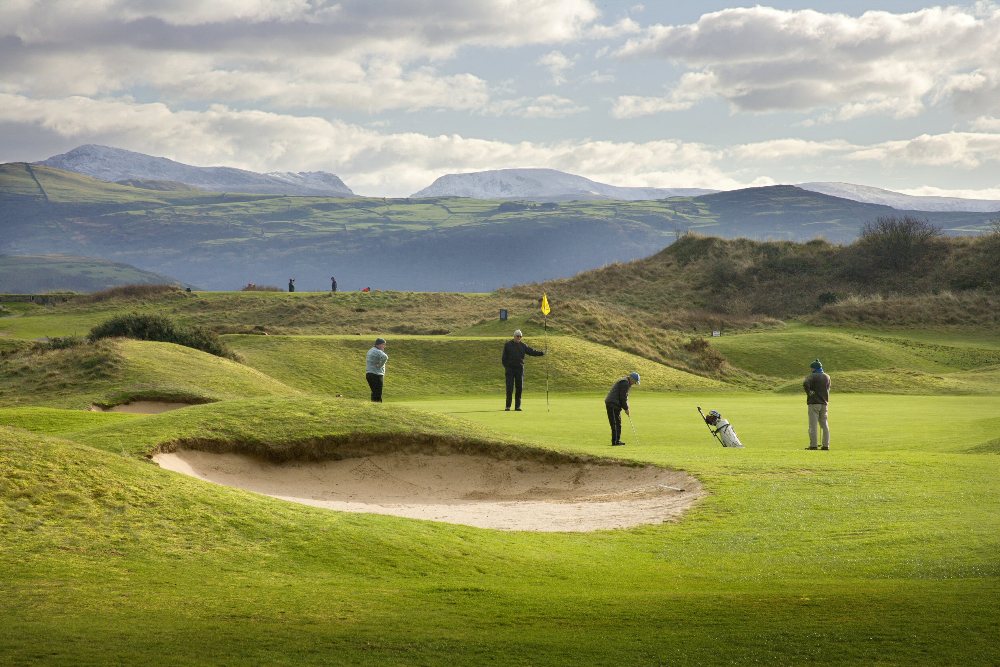 Golfers playing on Porthmadog golf course