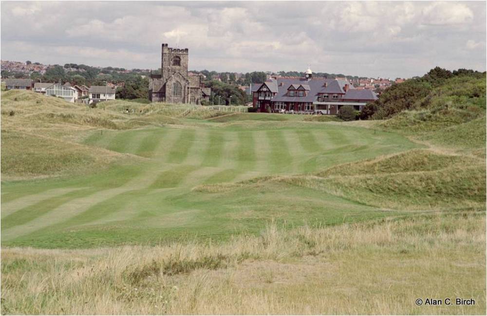 Large fairway and clubhouse at the Wallasey golf course