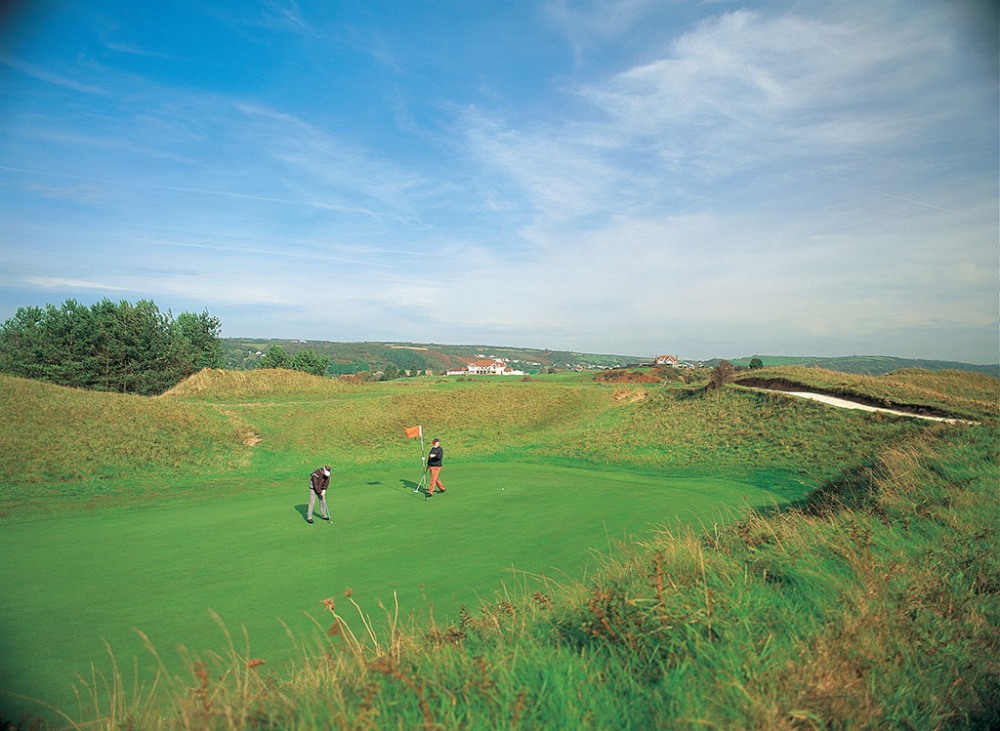 Golfers putting on the Ashburnham golf course