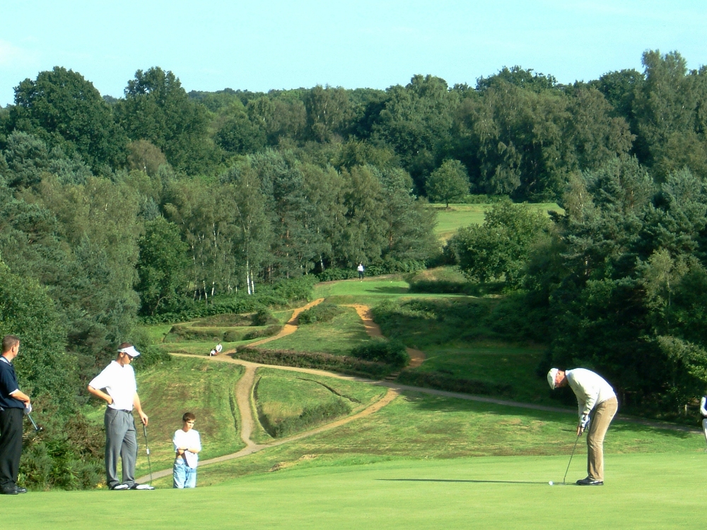 Golfers putting on the Old Course at the Royal Ashdown Forest golf club