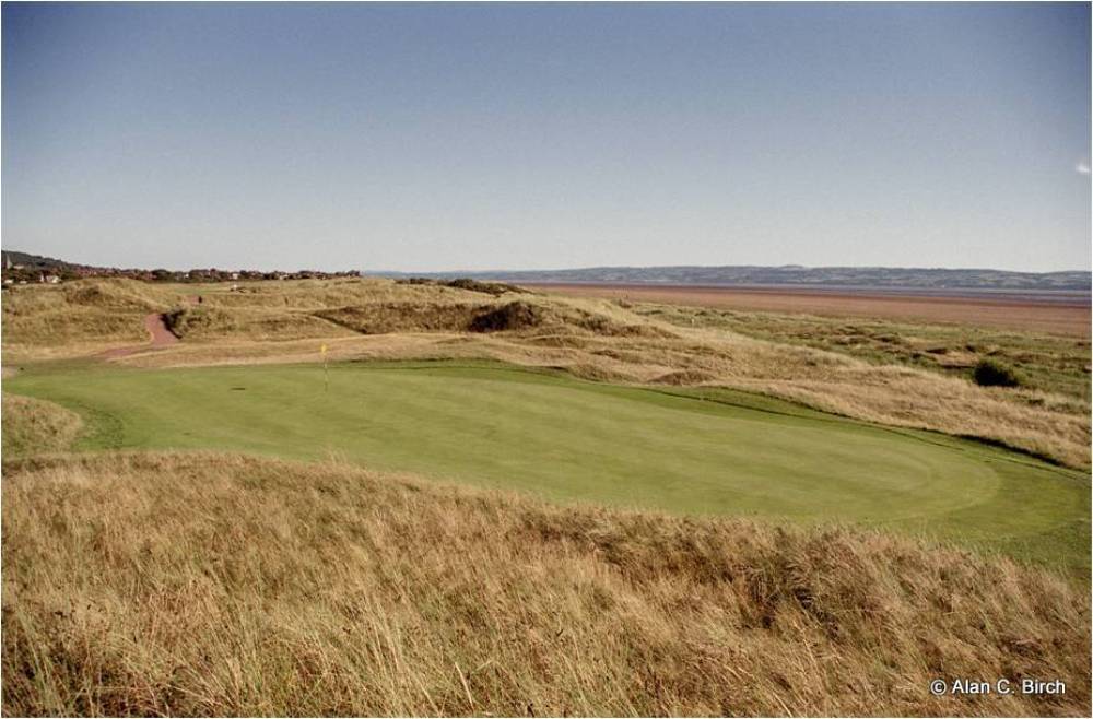 Large green, dunes and sea at the Royal Liverpool golf course