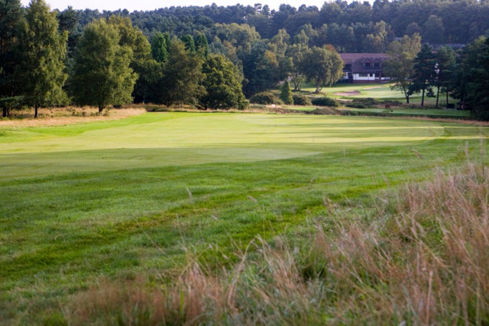 Large fairway and clubhouse on the Beau Desert golf course