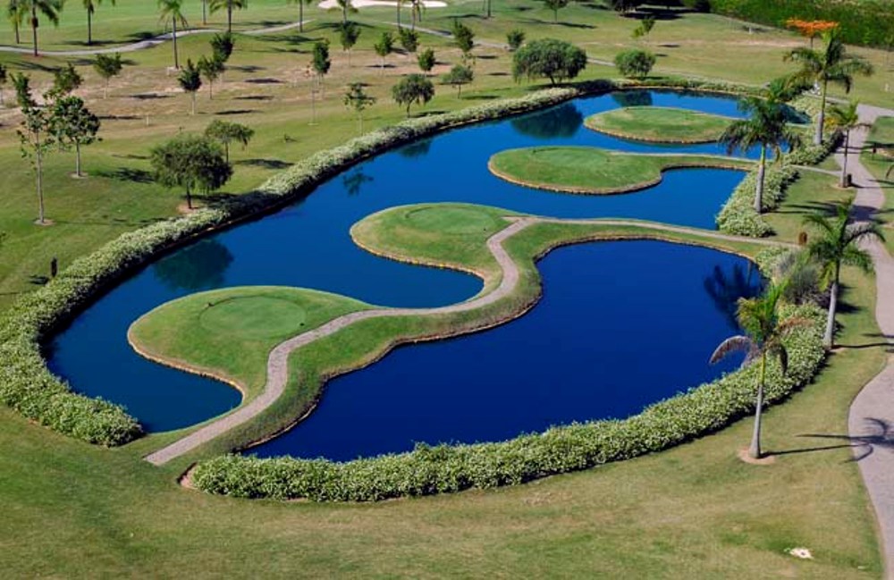 Four tees on a lake at the Damha golf course