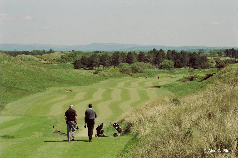 Golfers playing the Hillside golf course