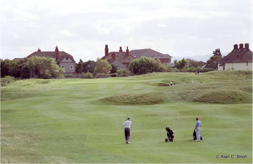 Golfers playing on the Royal Liverpool golf course