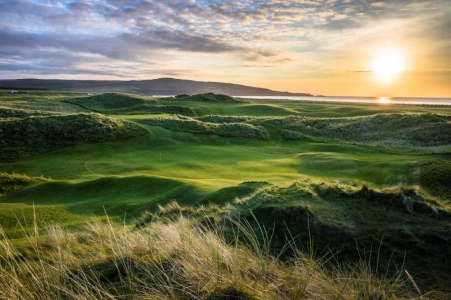 Sunset behind Machrie's green