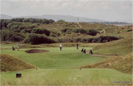 Golfers putting on the Wallasey golf course