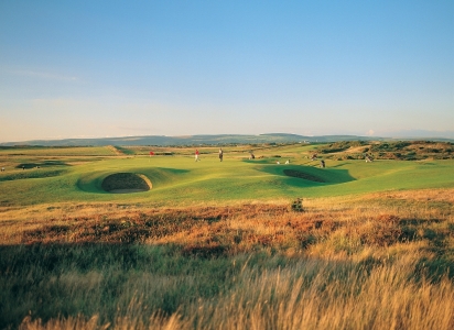Golfers playing on the Royal Porthcawl golf course