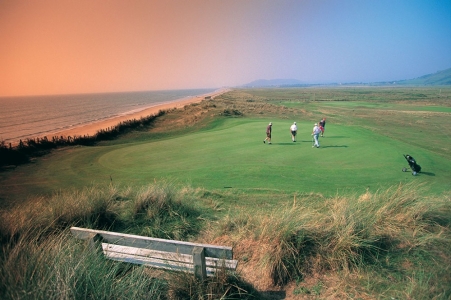 Golfers putting on the Aberdovey golf course