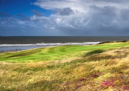 Elevated green and ocean at Royal Porthcawl