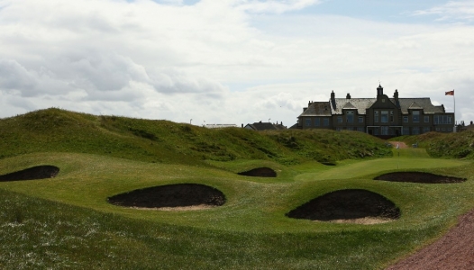 Hole defended by deep bunkers and clubhouse of St Annes Old Links