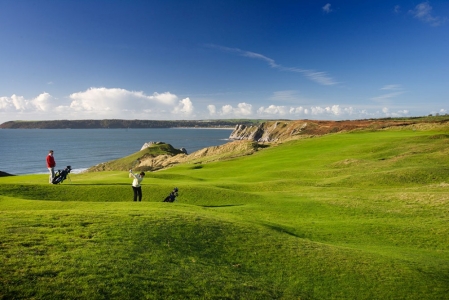 Golfers playing on top of the cliff at Pennard