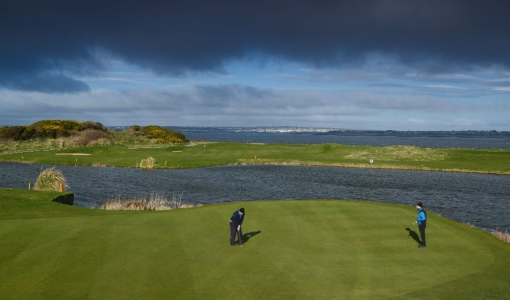 Golfers on the green on the Galway Bay Golf Course