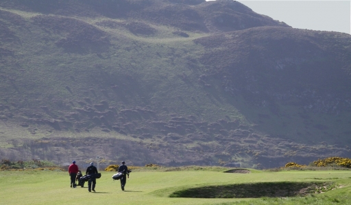 Golfers walking on Conwy golf course