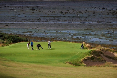Golfers on the 3rd green at Castle Stuart during the Tomatin Pro Am