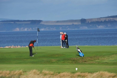 Golfers putting at Nairn during the Tomatin Pro Am