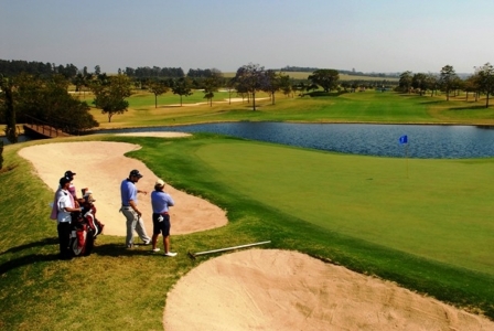 Golfers playing the Damha golf course
