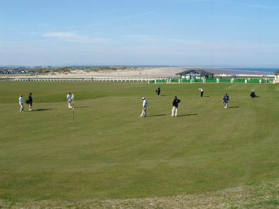 Golfers putting on the 18th green of the Old Course at St Andrews