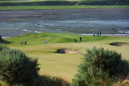 Golfers on the 3rd hole at Castle Stuart