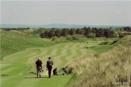 Golfers playing the Hillside golf course