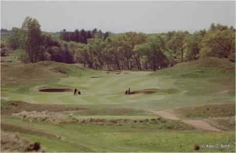 Golfers on a dogleg right hole on the Hillside golf course