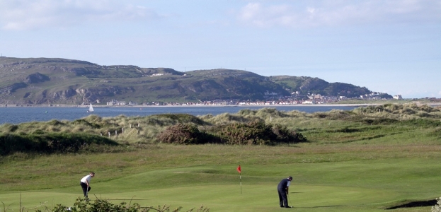 Players putting on Conwy golf course