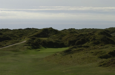 Tiny green and dunes on the West course at Saunton golf club