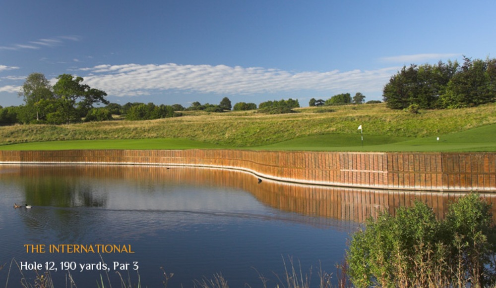 Green and lake on the 12th hole at the International golf course at London golf club